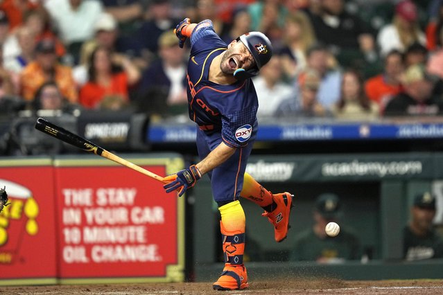 Houston Astros' Jose Altuve reacts after being hit by a pitch thrown by Oakland Athletics starting pitcher Ross Stripling during the third inning of a baseball game Monday, May 13, 2024, in Houston. (Photo by David J. Phillip/AP Photo)