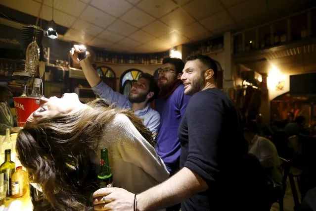 People take a selfie at La Marionnette Pub in Damascus, Syria, March 10, 2016. (Photo by Omar Sanadiki/Reuters)