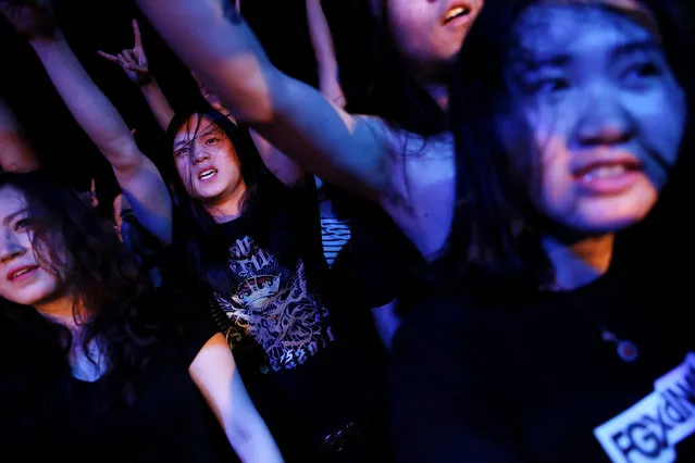 Fans enjoy the band called Suffocated performing on the stage of Mao Live House during the club's last public concert night in central Beijing, China April 24, 2016. (Photo by Damir Sagolj/Reuters)