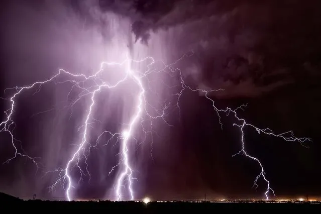 A massive lightning strike explodes over the town of Casa Grande in August 2011. (Photo by Mike Olbinski/Barcroft Media)