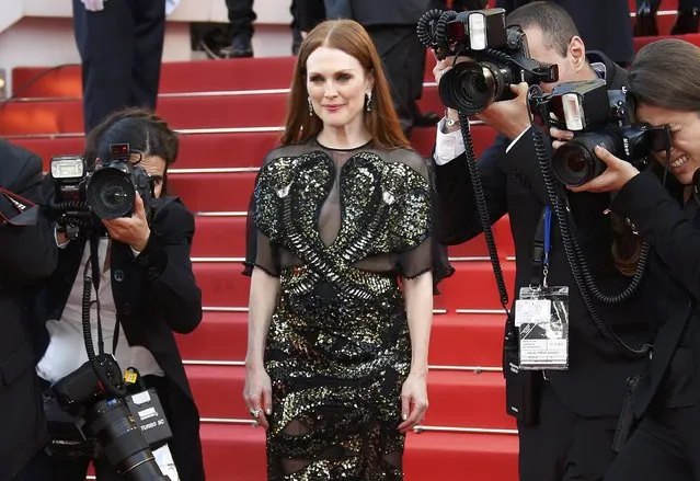 Actress Julianne Moore poses on the red carpet as she arrives for the opening ceremony and the screening of the film “Cafe Society” out of competition during the 69th Cannes Film Festival in Cannes, France, May 11, 2016. (Photo by Eric Gaillard/Reuters)