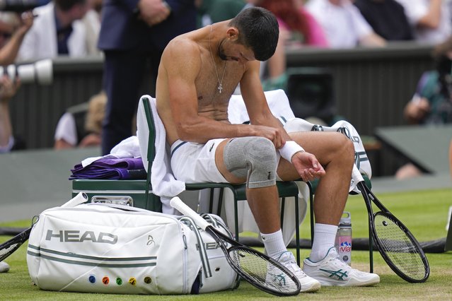 Novak Djokovic of Serbia looks down during a break in his match against Carlos Alcaraz of Spain during the men's singles final at the Wimbledon tennis championships in London, Sunday, July 14, 2024. (Photo by Alberto Pezzali/AP Photo)