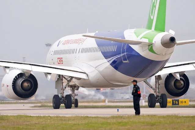 China's home-grown C919 passenger jet is seen at the Pudong International Airport ahead of its scheduled maiden flight in Shanghai, China May 5, 2017. (Photo by Aly Song/Reuters)