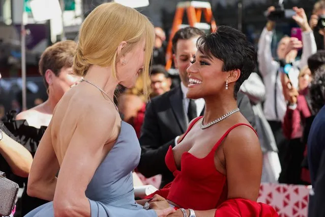 American actress, singer and dancer Ariana DeBose and American-Australian actress Nicole Kidman greet on the red carpet during the Oscars arrivals at the 94th Academy Awards in Hollywood, Los Angeles, California, U.S., March 27, 2022. (Photo by Mike Blake/Reuters)
