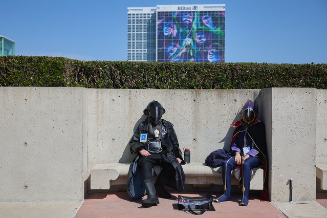 People in cosplay sit outside Comic-Con International in San Diego, California, USA, 25 July 2024. San Diego Comic-Con International is a comics arts conference held from 25-28 July 2024. (Photo by Allison Dinner/EPA)