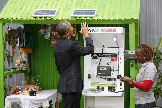 U.S. President Barack Obama (L) talks with a solar power businessperson at the Power Africa Innovation Fair at the United Nations compound in Nairobi, Kenya July 25, 2015. (Photo by Jonathan Ernst/Reuters)