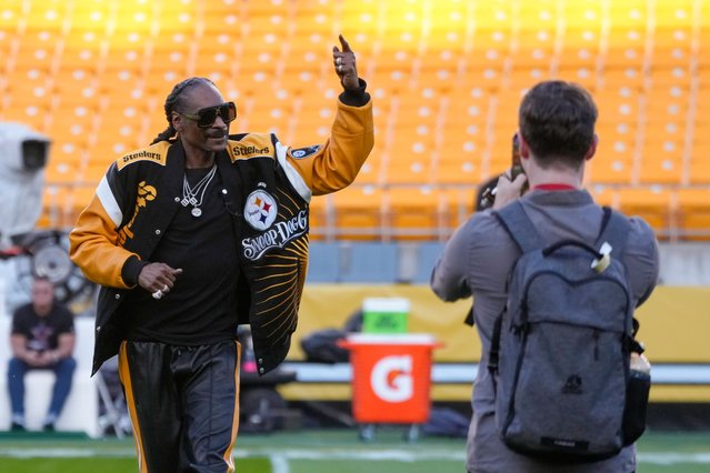 Rapper Snoop Dogg poses for photos prior to an NFL football game between the Pittsburgh Steelers and the Dallas Cowboys, Sunday, October 6, 2024, in Pittsburgh. (Photo by Gene J. Puskar/AP Photo)