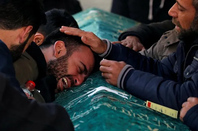 A man grieves during a funeral for earthquake victims in Elazig, Turkey, January 26, 2020. The magnitude 6.8 quake caused 41 deaths and injured more than 1,600 others. (Photo by Umit Bektas/Reuters)