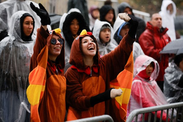 People attend the 98th Macy's Thanksgiving Day Parade in New York City on November 28, 2024. (Photo by Eduardo Munoz/Reuters)