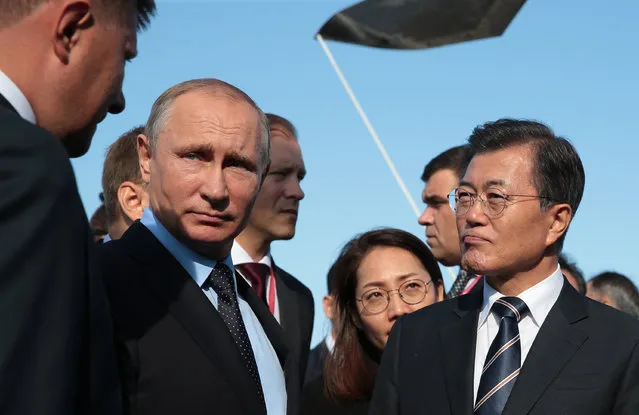 Russia's President Vladimir Putin (L) and South Korea's President Moon Jae-in attend the Far East Street exhibition as part of the Eastern Economic Forum at Far Eastern Federal University on Russky Island, Vladivostok, Russia on September 6, 2017. (Photo by Mikhail Metzel/TASS Host Photo Agency/Barcroft Images)