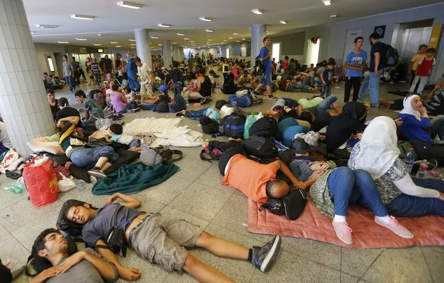 Migrants rest in an underground station near the main Eastern Railway station in Budapest, Hungary, September 1, 2015. (Photo by Laszlo Balogh/Reuters)