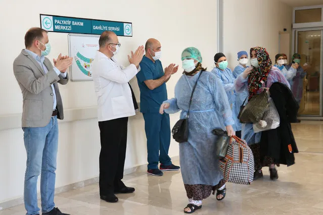 5 coronavirus patients, who recovered after new type of coronavirus (Covid-19) treatment are being discharged from the hospital and being sent to their houses accompanied by applauds of doctors and nurses, at Beysehir district in Turkey's Konya on April 14, 2020. (Photo by Abdulhamit Yasar/Anadolu Agency via Getty Images)