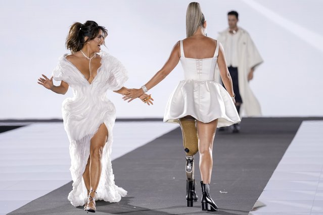 American actress Eva Longoria, left, and Mexican actress and beauty pageant titleholder Daniela Alvarez wear creations as part of the L'Oreal Spring/Summer 2025 collection presented Monday, September 23, 2024 in Paris. (Photo by Aurelien Morissard/AP Photo)