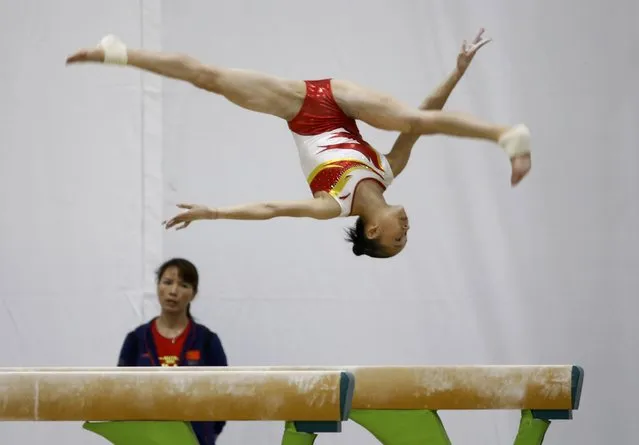 2016 Rio Olympics, Artistic Gymnastics, Training Session, Athletes Park, Rio de Janeiro, Brazil on August 2, 2016. Chinese gymnast practice on the beam. (Photo by Damir Sagolj/Reuters)
