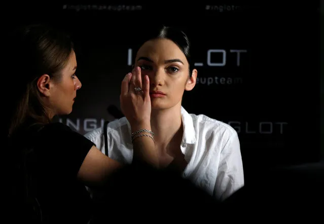 A model has her make up done backstage during the Tbilisi Fashion Week in Tbilisi, Georgia, October 27, 2017. (Photo by David Mdzinarishvili/Reuters)