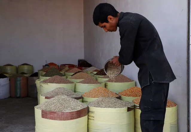 A Yemeni vendor displays various types of dry goods at a traditional market in Sanaa, Yemen, on Saturday, October 1, 2022. (Photo by Hani Mohammed/AP Photo)