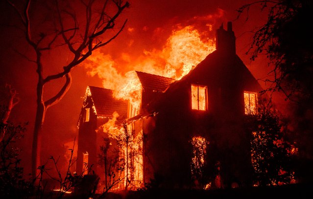 A home burns during the Eaton fire in the Altadena area of Los Angeles County, CA. on January 8, 2025. (Photo by USA Today)