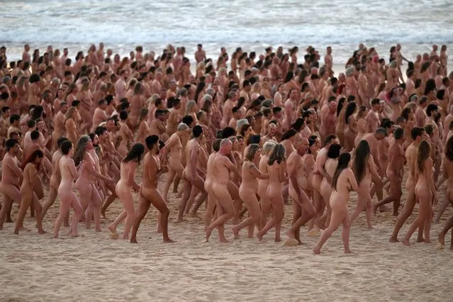Thousands of people stand nude, as part of an installation by contemporary artist Spencer Tunick, at Bondi Beach in Sydney, Australia 26 November 2022. Thousands of people have bared all for photographer Spencer Tunick at Sydney's Bondi Beach. The shoot aims to remind people to get checked for skin cancer. (Photo by Dean Lewins/AAP)