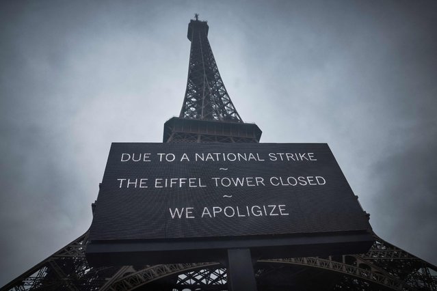 This photograph taken on February 19, 2024, in central Paris, shows a board informing visitors that the Eiffel Tower is closed as staff go on strike, over the financial management of the monument by the city, closing the monument to the public during the second week of the French school holidays. Unions of the operating company of the Eiffel Tower, the CGT and Force Ouvriere say the city, which owns 99 percent of the tower, has underestimated costs and overestimated revenues, whilst also hinting to the threat of a strike during the Olympic Games, held in Paris from July 26 to August 11. (Photo by Kiran Ridley/AFP Photo)