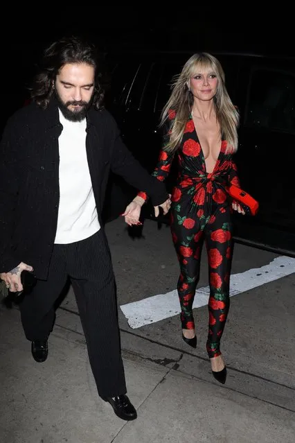 German-American model and television host Heidi Klum looks stunning as she shows off her cleavage in a floral skintight one piece jumpsuit as she and husband Tom Kaulitz hold hands while heading into Italian restaurant Giorgio Baldi for dinner in Santa Monica, CA. on December 23, 2022. (Photo by TPG/Backgrid USA)
