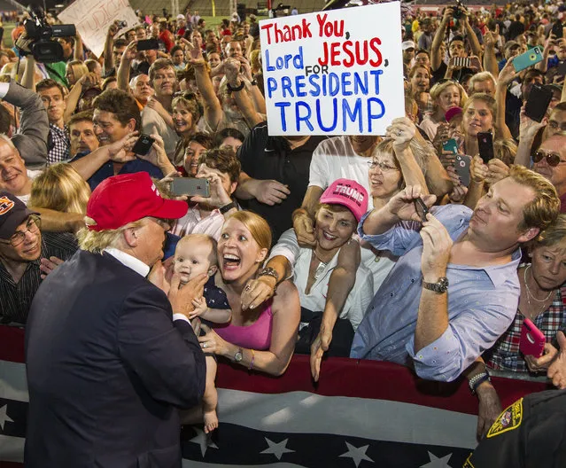 Republican presidential candidate Donald Trump greets supporters after his rally at Ladd-Peebles Stadium on August 21, 2015 in Mobile, Alabama. The Trump campaign moved tonight's rally to a larger stadium to accommodate demand. (Photo by Mark Wallheiser/Getty Images)