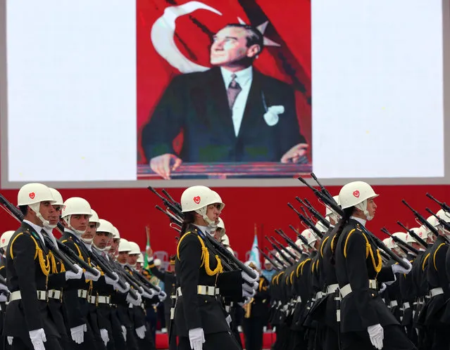 Turkish War Academy students parade during celebrations on Republic Day in Ankara, Turkey, Thursday, October 29, 2015. An image of Turkey's founder Mustafa Kemal Ataturk is in the background. (Photo by Burhan Ozbilici/AP Photo)