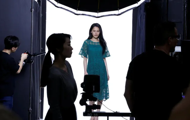 A model is seen during a shooting session for Amazon Fashion at an unveiling of its new photo studio in Tokyo, Japan March 15, 2018. (Photo by Toru Hanai/Reuters)