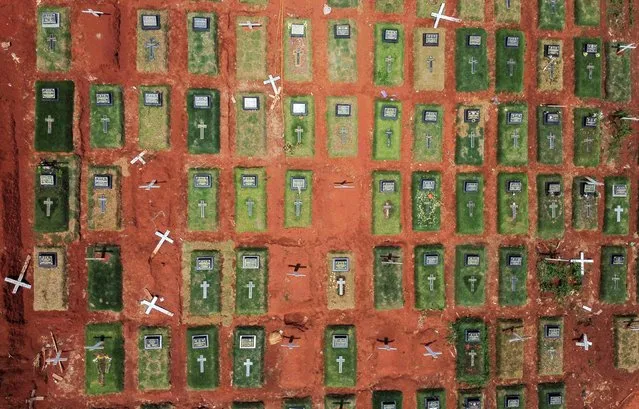 An aerial view shows the burial area provided by the government for victims of the coronavirus at Pondok Ranggon cemetery complex, in Jakarta, Indonesia on November 25, 2020. (Photo by Willy Kurniawan/Reuters)