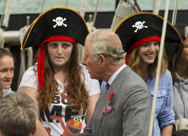 Britain's Prince Charles chats to trainees wearing pirate hats while on a visit to the Spirit of New Zealand Youth Training Vessel at Princes Wharf, Auckland, November 10, 2015. (Photo by Nigel Marple/Reuters)