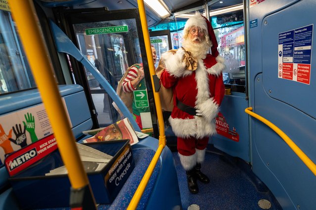 Santa and his elf in the first decade of November 2025 abandon the sleigh for a bus as they prepare for Winter Funland London, an indoor funfair at The Grand Hall, Olympia in UK, from December 12 to January 4. (Photo by Jeff Moore/The Times)