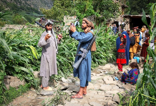Members of Taliban take pictures of the devastated village of Mazar Dara following a deadly magnitude-6 earthquake that struck Afghanistan, Kunar province, Afghanistan, on September 1, 2025. (Photo by Sayed Hassib/Reuters)