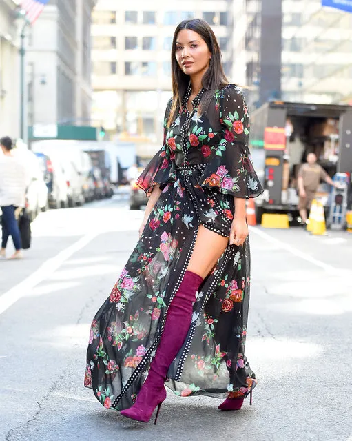 Olivia Munn seen wearing a floral dress with knee high boots in New York City, USA on May 24, 2018. (Photo by Robert O'neil/Splash News and Pictures)