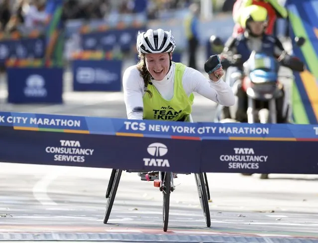 Tatyana McFadden of the U.S. crosses the finish line to win the womens wheelchair division of the 2016 New York City Marathon in Central Park in the Manhattan borough of New York City, New York, U.S. November 6, 2016. (Photo by Mike Segar/Reuters)