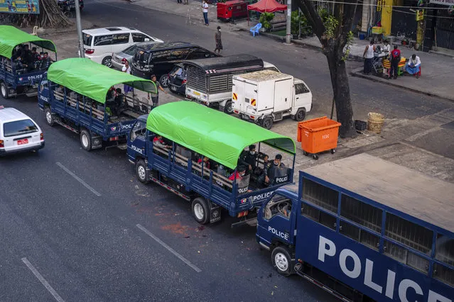 Police vehicles are parked on Sule Pagoda Road in Yangon, Myanmar, Monday, February 1, 2021 after the military staged a coup and detained senior politicians including Nobel laureate and de facto leader Aung San Suu Kyi. (Photo by @benjaminsmall via AP Photo)