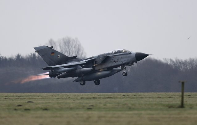 A German air force Tornado jet takes off from the German army Bundeswehr airbase in Jagel, northern Germany December 10, 2015. The first of the German air force Tornado reconnaissance jets took off for Turkey's Incirlik air base on Thursday, to support the military campaign against Islamic State. (Photo by Fabian Bimmer/Reuters)