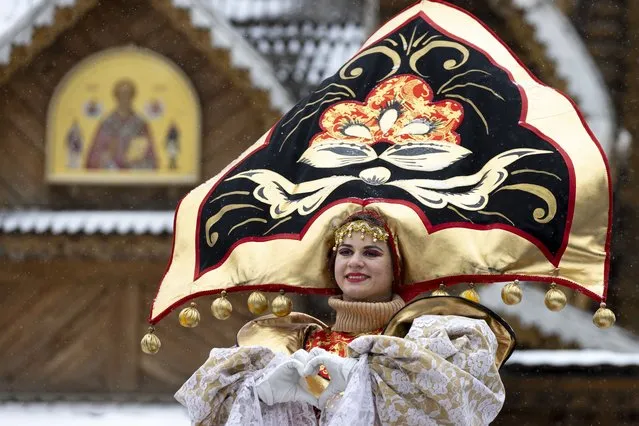 An artist performs during Maslenitsa (Shrovetide) holiday celebrations at the Izmailovsky Kremlin in Moscow, Russia, Saturday, March 13, 2021. (Photo by Alexander Zemlianichenko/AP Photo)