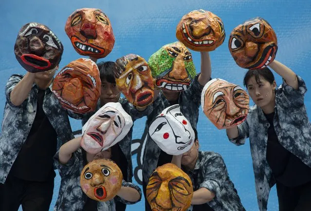 Members of the South Korean Confederation of Trade Unions (KCTU) perform with traditional Korean masks during a rally against the government's Labor Policy in Seoul, South Korea, 06 July 2023. South Korean Confederation of Trade Unions (KCTU) begen a general strike on a national scale from 03 July against the South Korean government's labor policy and against Japan's disposal of treated radioactive water from the Fukushima nuclear power plant into the sea. (Photo by Jeon Heon-Kyun/EPA)