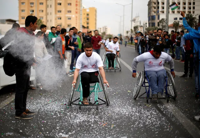 Disabled Palestinians compete during a local race organized by Assalama Charitable Society in Gaza City November 29, 2016. (Photo by Suhaib Salem/Reuters)