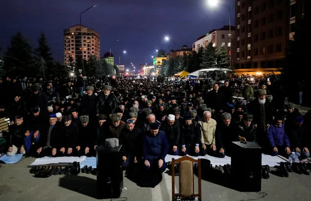 People pray during a protest against what they say was an unfair land swap deal with the neighbouring Russian region of Chechnya, in Ingushetia's capital Magas, Russia October 5, 2018. (Photo by Maxim Shemetov/Reuters)