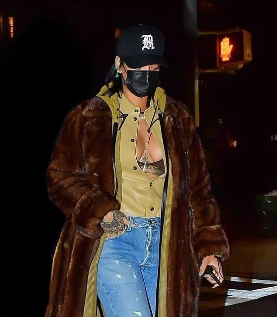 Barbadian singer Rihanna shows ample cleavage stepping out for a dinner date with A$AP Rocky and their friends in New York, NY. on January 20, 2021. The pair went to Emilio's Ballato restaurant which is owned by Katie Holmes' boyfriend, in SoHo. Rihanna couple arrived separately so as not to be photographed together and entered at different times and using different entrances. The restaurant was pretty crowded according to our eyewitness and it appeared to be a gathering with close friends for Yams Day which A$AP Rocky helped launch in honor or Steven Rodriguez, aka A$AP Yams who passed away from an opioid overdose in 2015. (Photo by Backgrid USA)