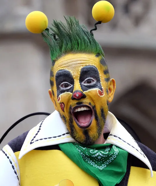 A  costumed reveler participates in a carnival parade in Braunschweig, northern Germany, Sunday, February 7, 2016. (Photo by Peter Steffen/DPA via AP Photo)