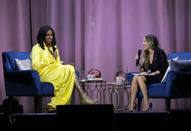Former first lady Michelle Obama, left, is interviewed by Sarah Jessica Parker during an appearance for her book, “Becoming: An Intimate Conversation with Michelle Obama” at Barclays Center on Wednesday, December 19, 2018, in New York. (Photo by Frank Franklin II/AP Photo)