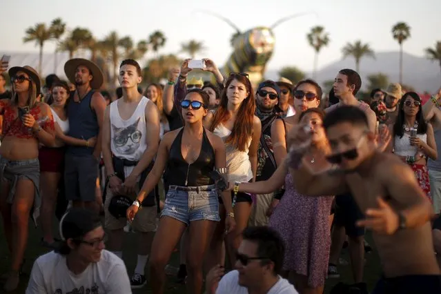People dance to Hozier at the Coachella Valley Music and Arts Festival in Indio, California April 11, 2015. (Photo by Lucy Nicholson/Reuters)