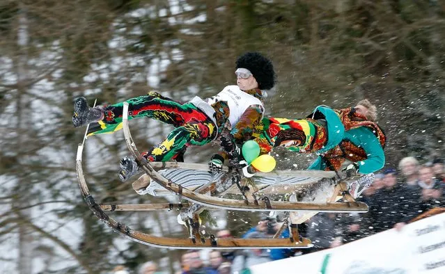 Participants race downhill during the traditional “Schnabler” horn sledge race in Gaissach, southern Germany, 27 January 2019. Traditionally used for transport by alpine farmers, the sledges are raced for fun nowadays. (Photo by Michaela Rehle/EPA/EFE/Rex Features/Shutterstock)