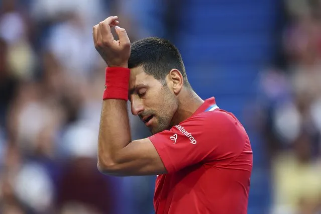 Novak Djokovic of Serbia wipes sweat from his brow during his match against Alex de Minaur of Australia at the United Cup tennis tournament in Perth, Australia, Wednesday, January 3, 2024. (Photo by Trevor Collens/AP Photo)