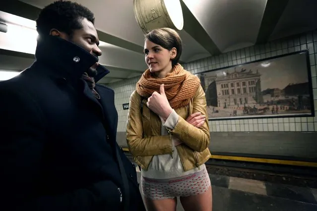 Participants inf the No Pants Subway Ride wait for a train in Berlin. (Photo by Adam Berry/Getty Images)