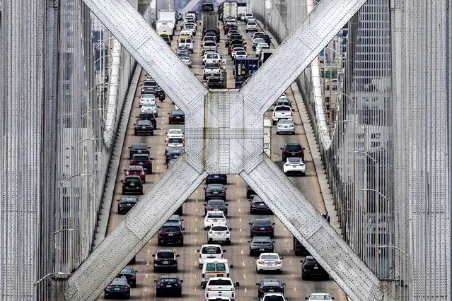 Vehicles drive across the San Francisco-Oakland Bay Bridge in San Francisco, California, U.S., October 26, 2021. (Photo by Carlos Barria/Reuters)