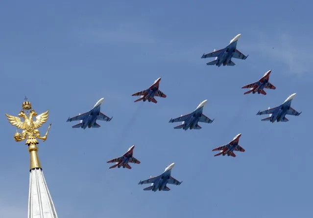 SU-27 and MIG-29 military jets fly in formation during the Victory Day parade above Red Square in Moscow, Russia, May 9, 2015. (Photo by Grigory Dukor/Reuters)