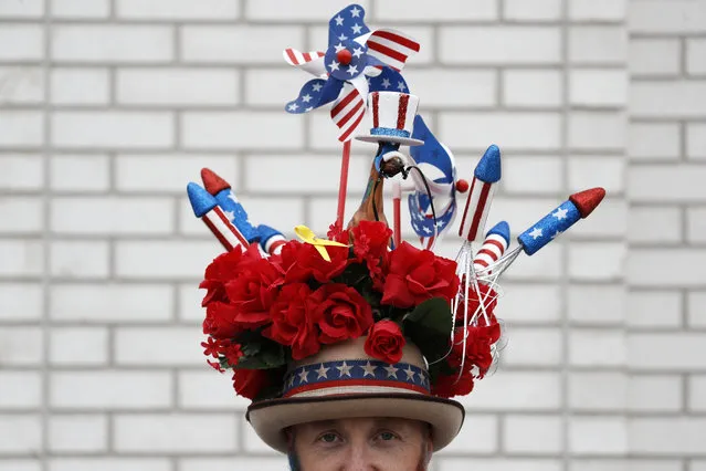 A man wears a hat before the 145th running of the Kentucky Derby horse race at Churchill Downs Saturday, May 4, 2019, in Louisville, Ky. (Photo by John Minchillo/AP Photo)