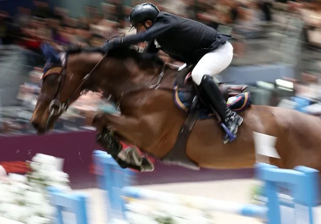 Colombian Rene Lopez Lizarazo riding Kheros Van't Hoogeinde competes in the "Grand Prix Hermes CSI 5" International Jumping Competition at the Grand Palais Ephemere in Paris, on March 17, 2024. (Photo by Franck Fife/AFP Photo)